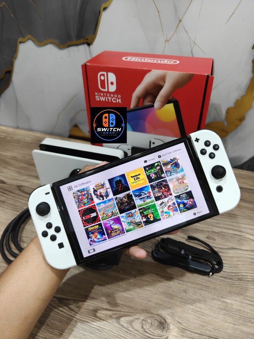 Nintendo Switch Oled with Free Games (Category: Nintendo) located in Manila. Submitted by nswitchgear (Listing ID 1452606372, Image 1). Description: 🎮 𝐅𝐎𝐑 𝐒𝐀𝐋𝐄: 𝐍𝐢𝐧𝐭𝐞𝐧𝐝𝐨 𝐒𝐰𝐢𝐭𝐜𝐡 𝐎𝐋𝐄𝐃 𝐌𝐨𝐝𝐞𝐥 with Free Games 🛒💰₱11,999 🎮Comes with 8 Accounts with Multiple Shared Game list can be installed no need to buy expensive games for mean time :) 📦 Complete Set: • Nintendo Switch OLED console • Dock • Joy-Con (L & R) • Joy-Con 