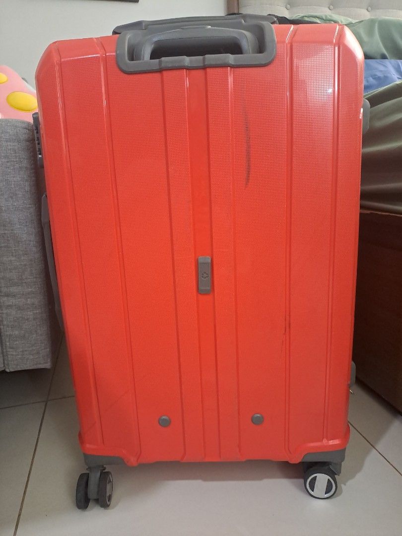 Orange Hardshell Spinner Luggage (Category: Luggage) located in Makati City. Submitted by isla29 (Listing ID 1452511799, Image 1). Description: - Brand: Compass - Orange hardshell luggage - Spinner wheels for easy maneuverability - Retractable handle - Some scuff marks from normal use - Airline sticker marks, can be removed - Fully functional and travel-ready.