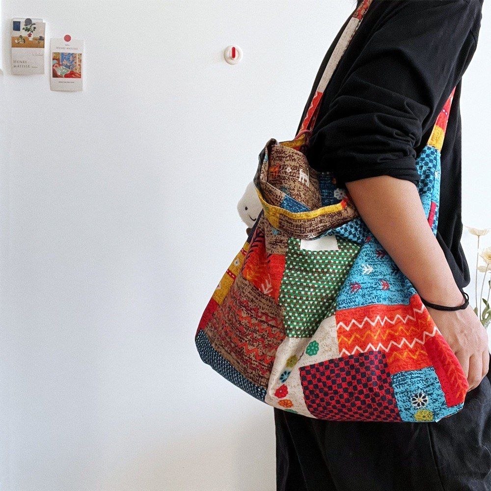 Patchwork Tote Bag (Category: Tote Bags) located in Singapore. Submitted by fiveftfour (Listing ID 1452576644, Image 1). Description: - Super cute patchwork tote bag - Features colorful patterns all over - Comes with a fun cloud charm - Ideal for everyday use or travel - Spacious interior - Comfortable straps for carrying - Unique and eye-catching design.