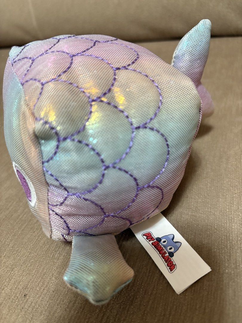 Pet Simulator Rainbow Fish Plush Toy (Category: Plushies & Soft Toys) located in Cavite. Submitted by marissa0_0 (Listing ID 1452685114, Image 2). Description: - Cute rainbow fish plush toy - From the popular game Pet Simulator - Soft and squishy material - Great for fans and collectors - Ideal as a gift - Comes with the official Pet Simulator tag attached.