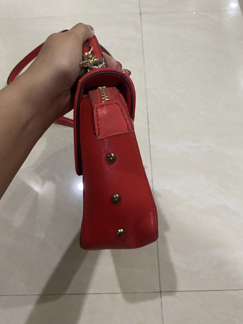 Playboy Red Sling Bag (Category: Cross-body Bags) located in San Pedro. Submitted by declutterbymb (Listing ID 1452638427, Image 3). Description: - 7/10 condition - has signs of use - personal preloved - nice pa siya since di naman noticeable mga issues ‼️Payment First 📍San Pedro, Laguna 🚚 J&T or Lalamove.