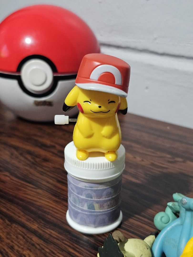 Pokemon Pikachu Wind-up Toy (Category: Character Goods) located in Paranaque City. Submitted by viviperera (Listing ID 1452691383, Image 1). Description: - Adorable Pikachu wind-up toy - Features a cute red hat - Includes a Pokeball accessory - Comes in a clear base container with purple tape inside - Perfect gift for Pokemon fans!.
