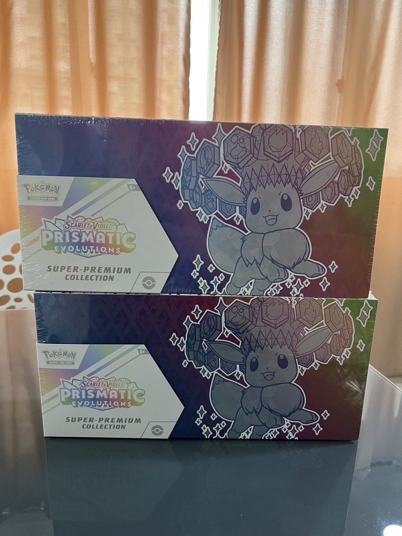Pokemon Scarlet & Violet Prismatic Evolutions Super-Premium Collection (Category: Card Boxes & Cases) located in Quezon City. Submitted by stylebook_ph (Listing ID 1452547469, Image 1). Description: - Pokemon Scarlet & Violet Prismatic Evolutions Super-Premium Collections - Each box features Eevee artwork - Ideal for collectors and players - Great value when buying both.