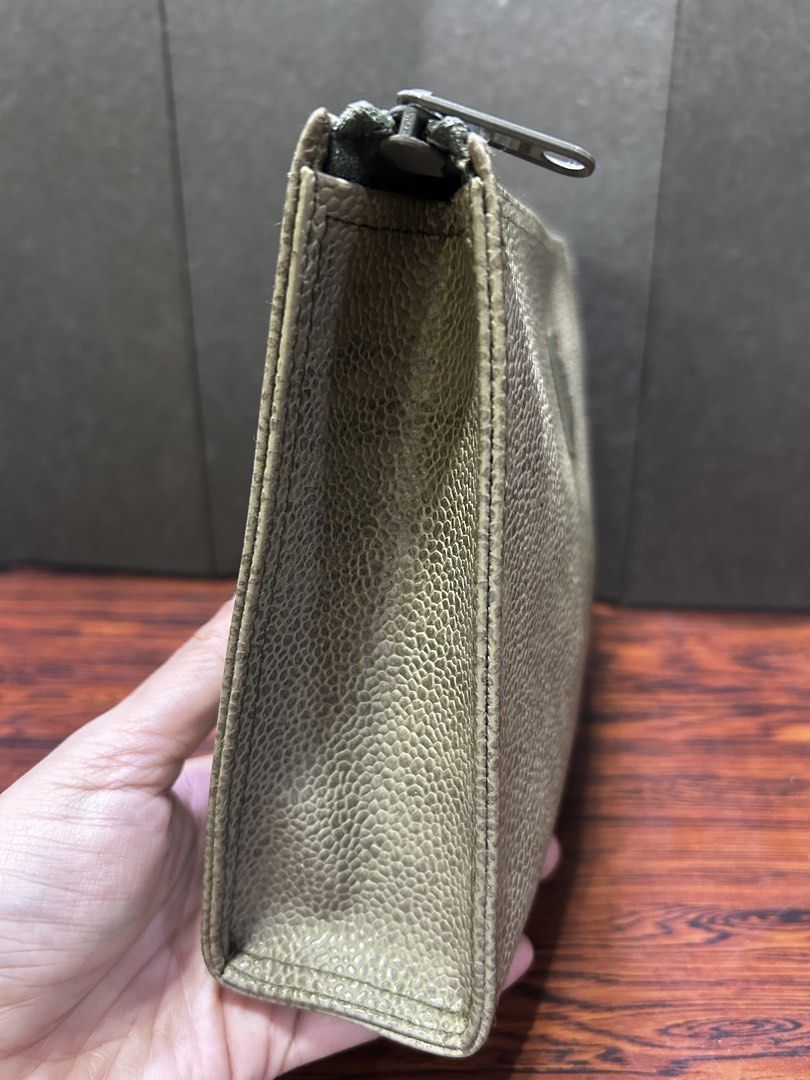 Pouch Clutch Bag Monogram Leather Olive Green (Category: Luxury Bags & Wallets) located in Manila. Submitted by starbalesukandjapansurplus (Listing ID 1452517612, Image 3). Description: - Olive green MCM pouch - Textured leather exterior - Zipper closure - Interior pockets for organization - Versatile: use as a clutch or bag organizer - Shows some signs of wear inside.