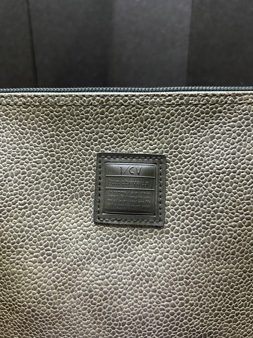 Pouch Clutch Bag Monogram Leather Olive Green (Category: Luxury Bags & Wallets) located in Manila. Submitted by starbalesukandjapansurplus (Listing ID 1452517612, Image 2). Description: - Olive green MCM pouch - Textured leather exterior - Zipper closure - Interior pockets for organization - Versatile: use as a clutch or bag organizer - Shows some signs of wear inside.