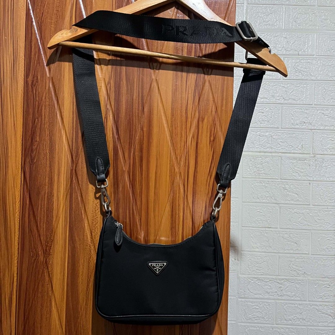 Prada Black Nylon Shoulder Bag (Category: Luxury Bags & Wallets) located in Manila. Submitted by abj_thriftshop (Listing ID 1452533430, Image 1). Description: - Black Prada Shoulder Bag - Durable Nylon Material - Sleek Silver Hardware with Iconic Prada Logo Clasp - Adjustable Shoulder Strap with Prada Branding - Secure Zipper Closure - Ideal for Everyday Use.