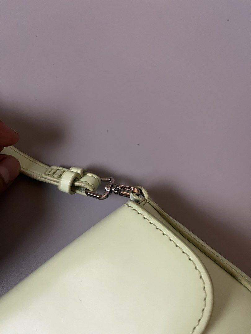 Prada Cleo Flap light green (Category: Luxury Bags & Wallets) located in Lucena. Submitted by brkrobert (Listing ID 1452512651, Image 3). Description: - Prada shoulder bag - Light green leather - Iconic Prada triangle logo - Silver hardware details - Interior slip pocket - Secure snap closure - Ideal for everyday use - minor stains at the back unnoticeable when worn.