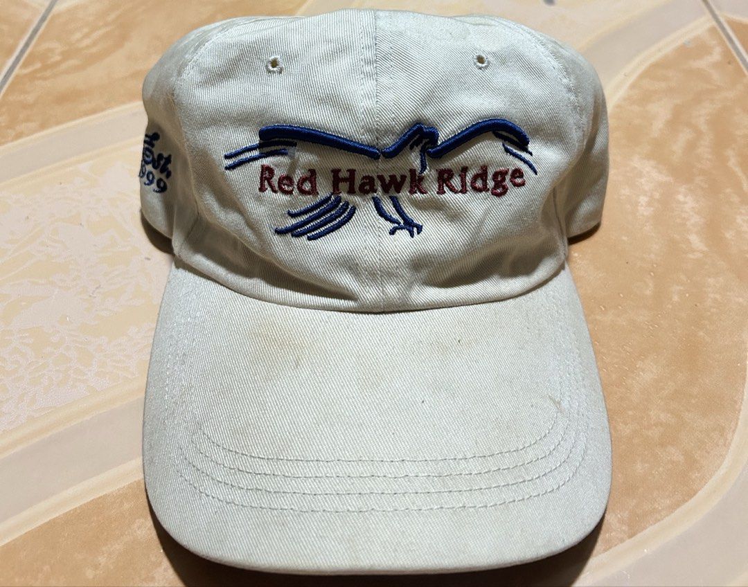 Red Hawk Ridge Embroidered Baseball Cap (Category: Caps & Hats) located in Manila. Submitted by dcoolest (Listing ID 1452651990, Image 1). Description: - Cream colored baseball cap - Features Red Hawk Ridge embroidery - Includes a bird graphic and text - Adjustable strap at the back for a custom fit - Note: Some light marks on the brim - Ideal for everyday casual wear.