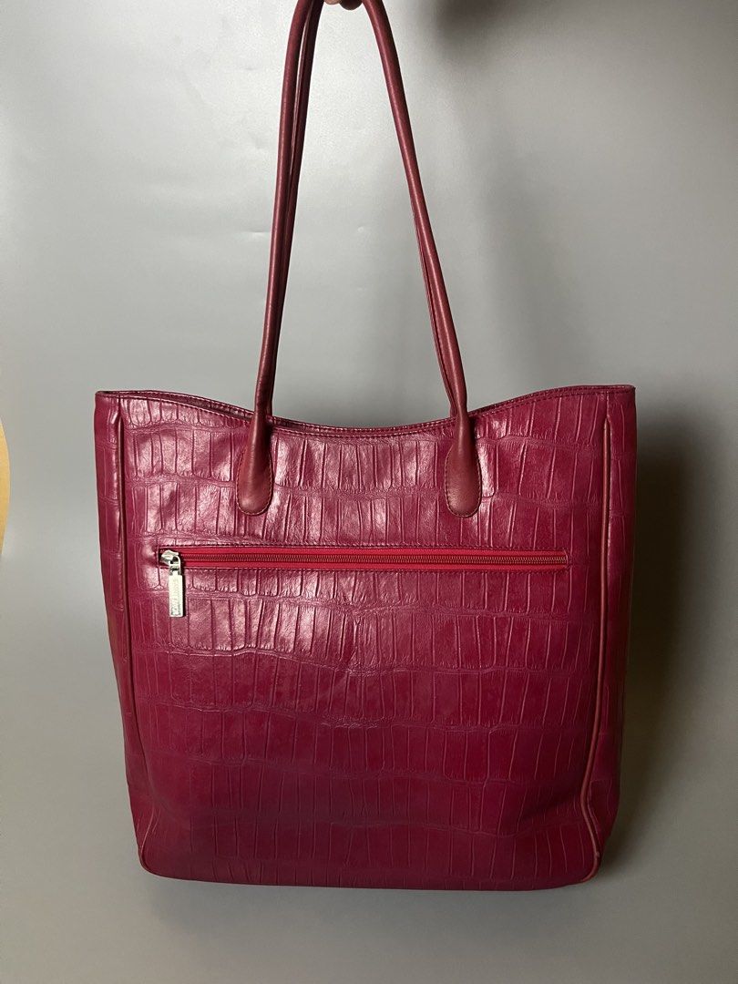 Saint Jack Pink Croc Embossed Leather Tote Bag (Category: Tote Bags) located in Lucena. Submitted by brkrobert (Listing ID 1452666016, Image 3). Description: - Stylish pink leather tote bag - Elegant croc-embossed texture - Convenient zippered pocket on the back - Roomy and spacious interior - Comfortable shoulder straps for easy carrying - A timeless, classic choice for everyday style.