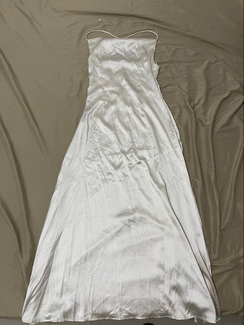 Satin Cowl Neck Spaghetti Strap Maxi Dress (Category: Dresses) located in Manila. Submitted by emericerv (Listing ID 1452626081, Image 3). Description: - Beautiful satin maxi dress - Features a flattering cowl neckline - Delicate spaghetti straps - Floor-length, elegant silhouette - Criss-cross strap detail on the back - Drapes beautifully, feels like a silk blend - Ideal for formal events, weddings, or a night out -Champagne Color -Best fits Sma
