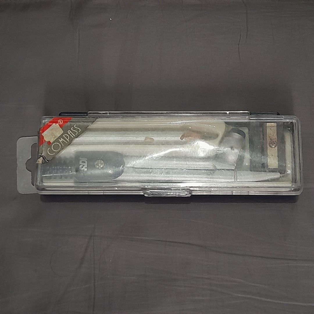 SDI Drawing Compass Set with Pencil & Sharpener (Category: Stationery & School Supplies) located in Dasmarinas. Submitted by pb_declutters (Listing ID 1452531812, Image 2). Description: Selling a pre-loved SDI Drawing Compass Set. Perfect for school geometry classes, drafting, or art projects. What's Included: 1x SDI Metal Drawing Compass 1x Wooden Pencil (sharpened) 1x Small Pencil Sharpener 1x Original Hard Plastic Storage Case Item Condition: 