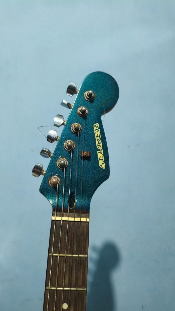 Selder Electric Guitar - Teal (Category: Musical Instruments) located in Manila. Submitted by judorant9363 (Listing ID 1452549637, Image 2). Description: - Low Action (Undergone basic set-up) - Teal electric guitar - 6 strings - Standard pickup configuration - Minor signs of wear on bridge hardware - Functional tuners - Straight neck - Ready for a new home.