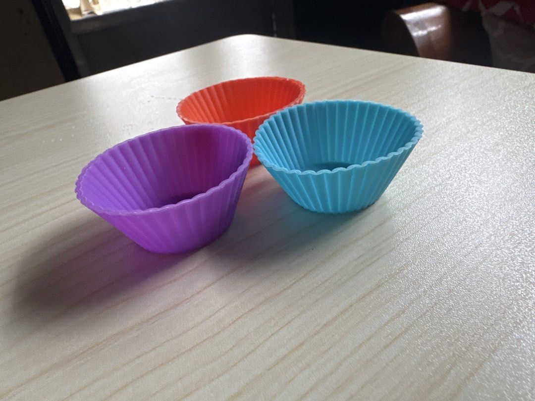 Silicone Reusable Small Cupcake Liners for Bento (Category: Bakeware) located in Quezon City. Submitted by big_fat_momma (Listing ID 1452513694, Image 2). Description: - Set of 3 silicone cupcake liners - Includes purple, orange, and blue colors - Ideal for bento since it is small - Easy to clean and reusable - Adds fun colors to your bento snacks.