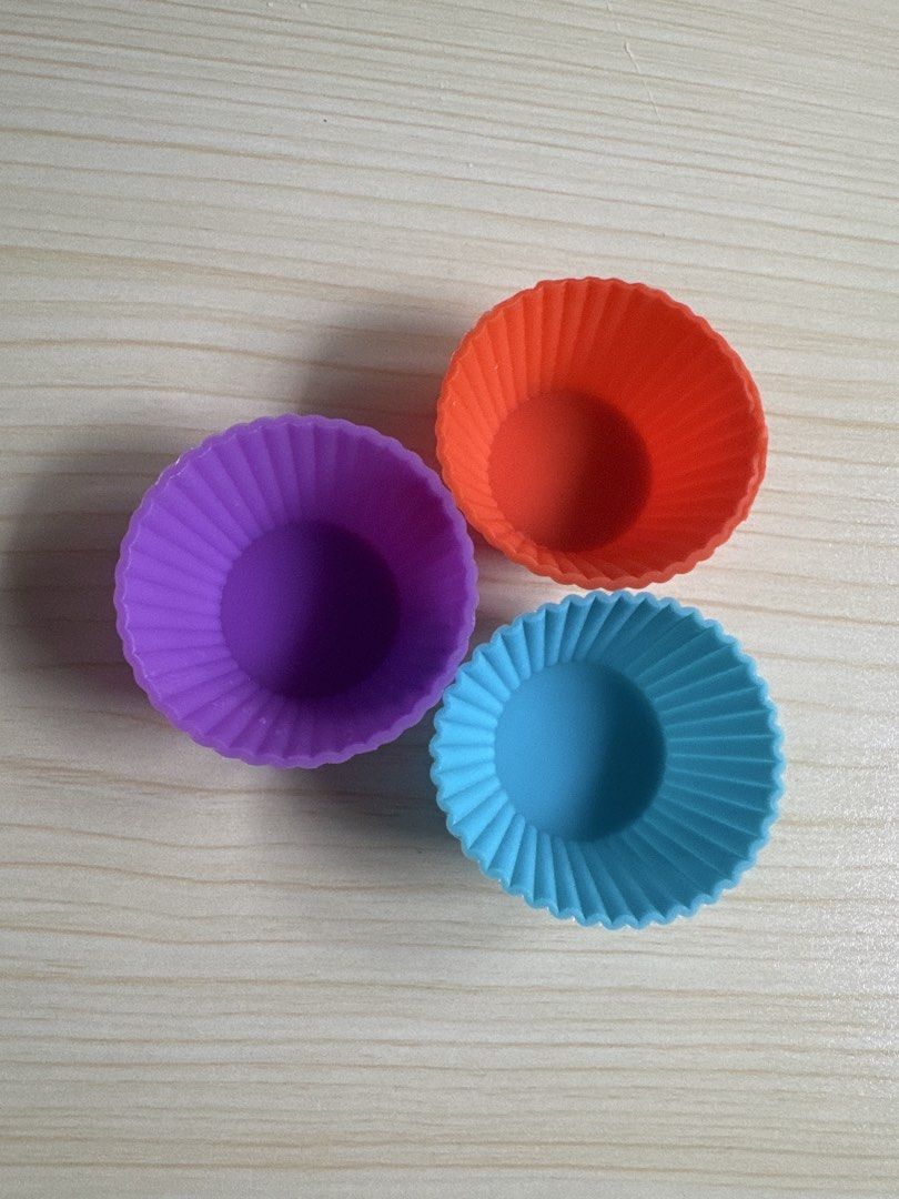 Silicone Reusable Small Cupcake Liners for Bento (Category: Bakeware) located in Quezon City. Submitted by big_fat_momma (Listing ID 1452513694, Image 1). Description: - Set of 3 silicone cupcake liners - Includes purple, orange, and blue colors - Ideal for bento since it is small - Easy to clean and reusable - Adds fun colors to your bento snacks.