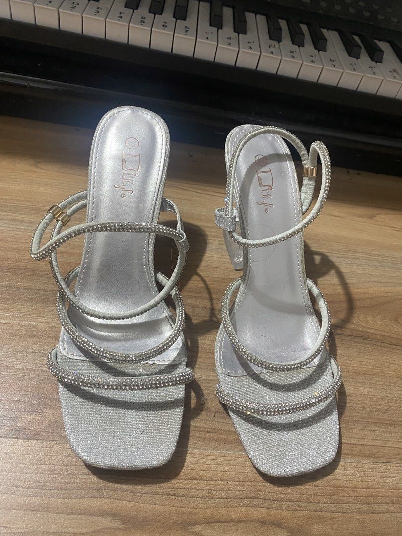 Silver Rhinestone Size 9✨ (Category: Heels) located in Bulacan. Submitted by Spothings (Listing ID 1439841914, Image 2). Description: 🔹Used once only 🔹ginamit lang sa kasal 🔹like new - Silver sandals with rhinestone straps - Square toe design - Clear, chunky heel - Multiple straps for secure fit - Perfect for special occasions.