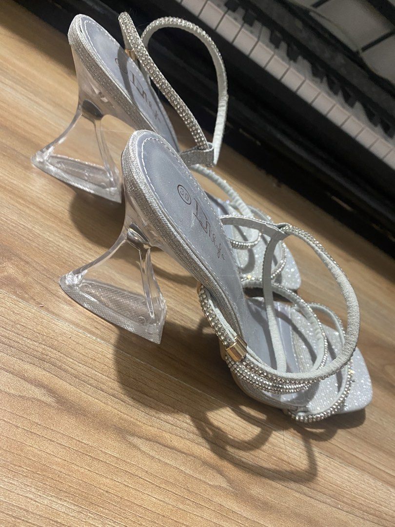 Silver Rhinestone Size 9✨ (Category: Heels) located in Bulacan. Submitted by Spothings (Listing ID 1439841914, Image 3). Description: 🔹Used once only 🔹ginamit lang sa kasal 🔹like new - Silver sandals with rhinestone straps - Square toe design - Clear, chunky heel - Multiple straps for secure fit - Perfect for special occasions.