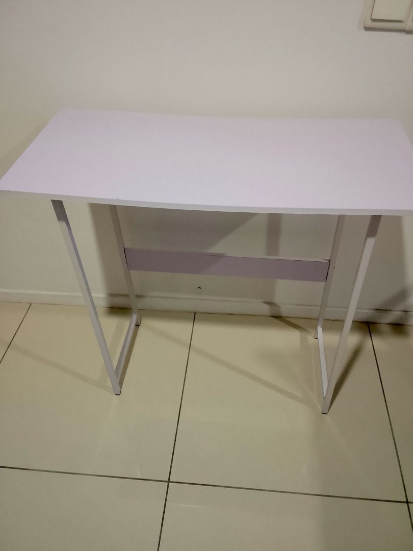 Small Work/Study Table (Used) (Category: Tables & Sets) located in Seri Kembangan. Submitted by shop-like (Listing ID 1452601050, Image 1). Description: Used item: Table Dimension: 37cm (width) x 80cm (length) x 74cm (height) Condition: Good (no crack, all screws are there), One table leg is shorter (can be adjusted by you) Can dismantle. Got mini tools. RM5 only! How to deal? - Self-collect at Dream City Apartment, Seri Kembangan - Prepare the e