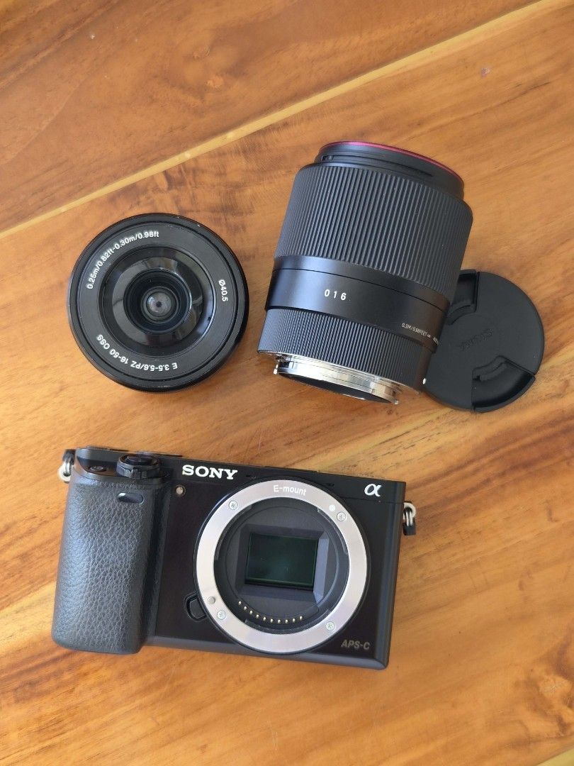 Sony Alpha a6000 Mirrorless Camera with 2 Lenses (Category: Cameras) located in Manila. Submitted by mugglesurreal118 (Listing ID 1452658629, Image 2). Description: - Sony Alpha a6000 mirrorless camera body +kit lens + sigma lens 16mm & 30mm.