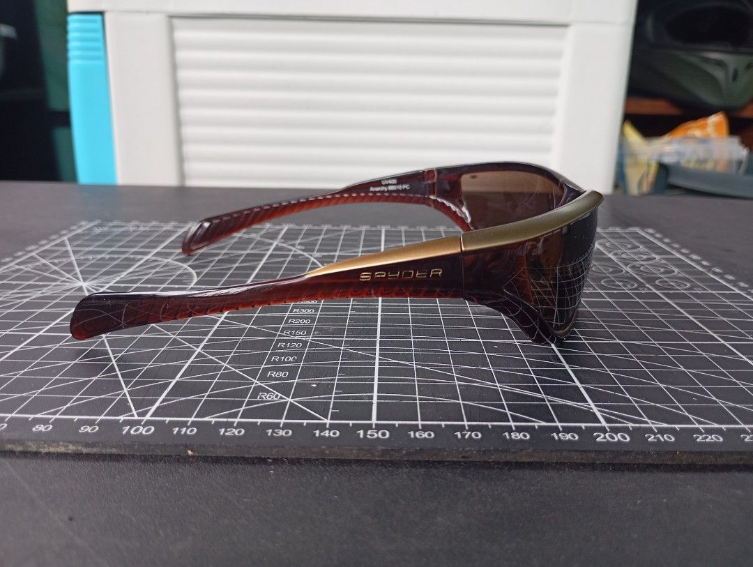 Spyder Anarchy 88010 PC Sunglasses (Category: Sunglasses & Eyewear) located in Manila. Submitted by c4rtlene (Listing ID 1452549660, Image 3). Description: - Spyder Anarchy Sunglasses - Model: 88010 PC - Frame: Brown tortoise shell with gold accents - Style: Sporty wrap-around - Lenses: Brown tinted - Protection: UV400 - Ideal for: Outdoor activities.