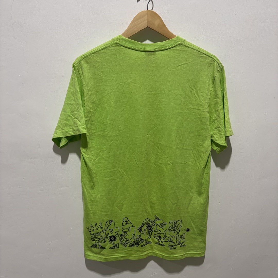 Stussy Graphic Tee Neon Green (Category: Tshirts & Polo Shirts ) located in Dapitan. Submitted by payt3es_thrift. (Listing ID 1452626851, Image 3). Description: - Vibrant neon green Stussy graphic t-shirt. - Features a fun cartoon character skateboarding on the front. - Row of illustrated characters at the back hem. - Made of 100% comfortable cotton. - Easy care: Machine washable. -dimes 19x29.