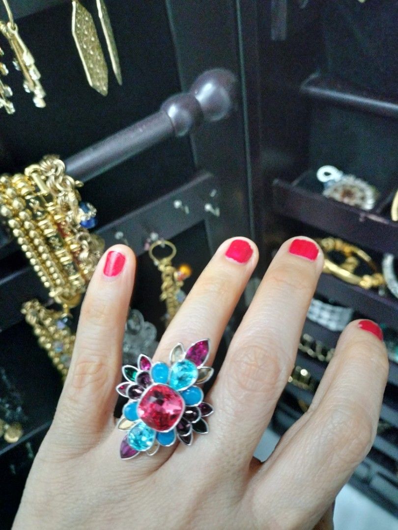 Swarovski Flower Ring with Multi-colored Crystals (Category: Rings) located in Davao. Submitted by cons_mare (Listing ID 1452662155, Image 3). Description: - Genuine Swarovski ring - Beautiful flower design - Features pink, blue, and green crystals - Comes with original box - Ideal statement piece for any occasion - Adds sparkle to your jewelry collection Bought at Rustan's for P 14,500.00 You can bring this ring to any Swarovski store for cleani