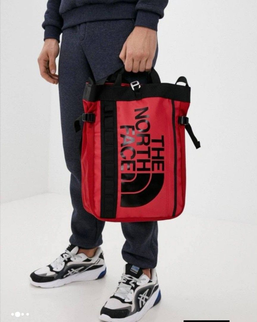 The North Face Base Camp Tote Backpack Red (Category: Backpacks) located in Cebu City. Submitted by MrLiks_123 (Listing ID 1452551348, Image 1). Description: THE NORTH FACE base camp PVC waterproof laminated duffel tote bag Length 17 / width 15½ Heavy-Duty Construction : - It utilizes the iconic water-resistant TPE PVC fabric that allows the bag to keep its boxy shape and easily wipe clean Modular Straps: - It features standard top handles for ha