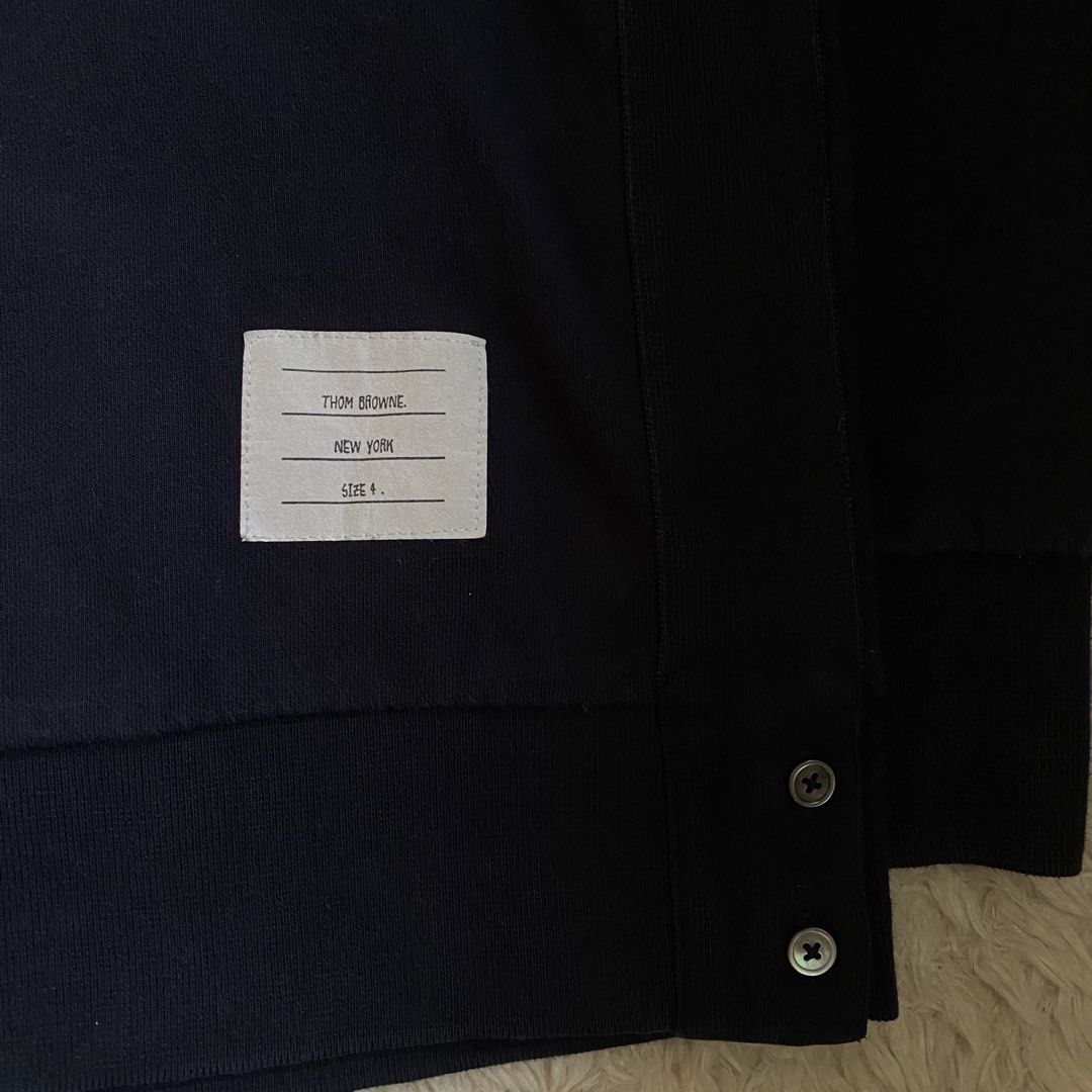 Thom Browne 4 Bar Sweatshirt Navy (Category: Luxury Apparel) located in Cebu City. Submitted by stevenkylegil (Listing ID 1452599508, Image 2). Description: Thom Browne 4 Bar Sweatshirt Navy Dimension: 22 width / 27.5 length Color rate: 10/10 Excellent condition - No issue Message me📩.