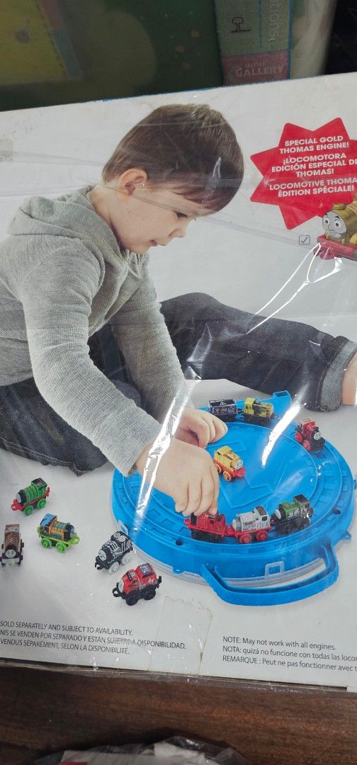 Thomas & Friends Minis 16-Piece Train Set with Carry Case (Category: Vehicle & Diecast Models) located in Manila. Submitted by martinascorner (Listing ID 1452537588, Image 3). Description: Thomas & Friends Minis Collector's Playwheel by Fisherprice. For ages 3+ - Thomas & Friends Minis Carry Case - Round play area included - Stores up to 16 mini trains - Comes with 15 mini trains with rare exclusive golden Thomas included 1,200 only. Selling as p