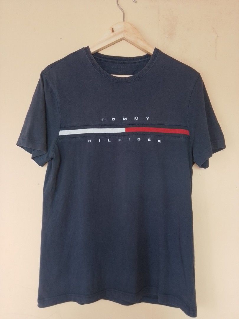 Tommy Hilfiger Navy Blue Tee (Category: Tshirts & Polo Shirts ) located in Mabalacat. Submitted by zero2mthrift (Listing ID 1452567902, Image 2). Description: 19.5 x 27 size Meduim on tag Excellent condition Complete tags(authentic) No issue Location: Pampanga.