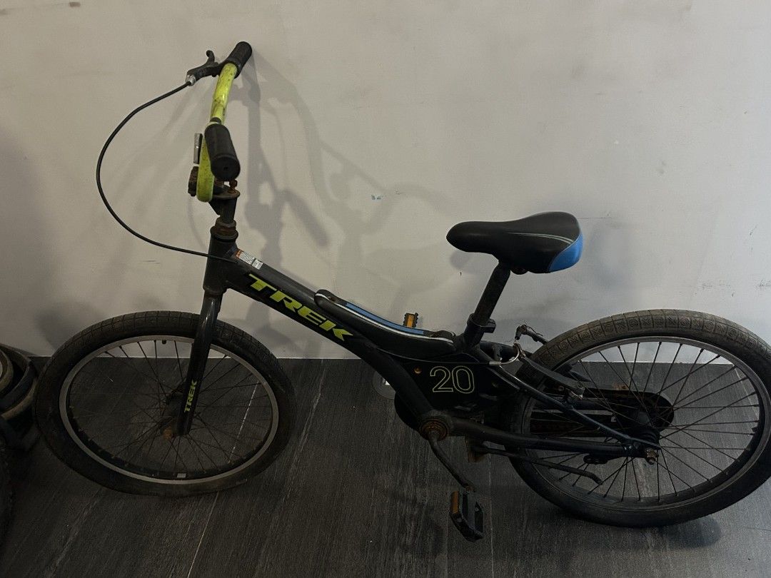 Trek 20" Kids Bike (Category: Bicycles) located in Manila. Submitted by daenzooo858172 (Listing ID 1452594756, Image 1). Description: - Trek kids bike - 20-inch wheels - Black frame with yellow handlebars - Blue seat accents - Shows some wear and tear, but in solid working condition - Perfect for learning or casual riding.