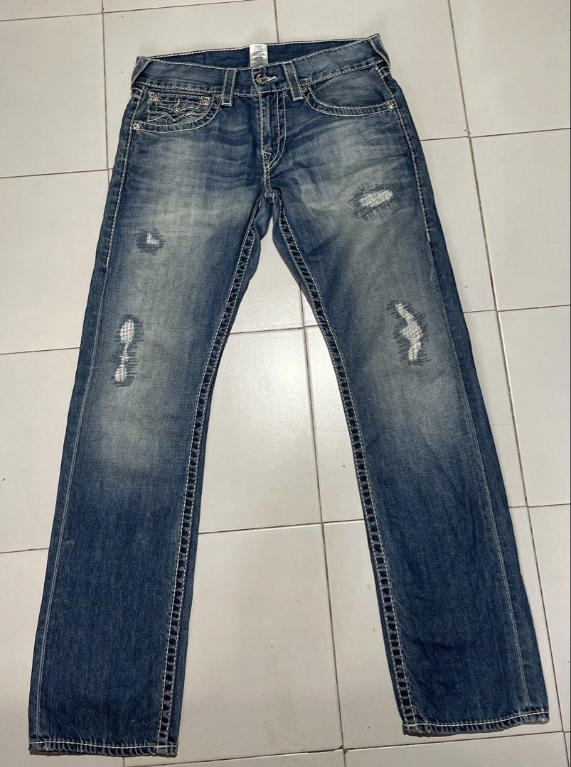 True Religion Jeans Distressed Blue Denim (Category: Jeans) located in Opol. Submitted by johnalbert.thrift (Listing ID 1452608752, Image 1). Description: - Classic blue denim jeans - Stylish distressed details - Clean white contrast stitching - Comfortable straight leg fit - Ideal for everyday casual wear -size 31 on tag -33x43.