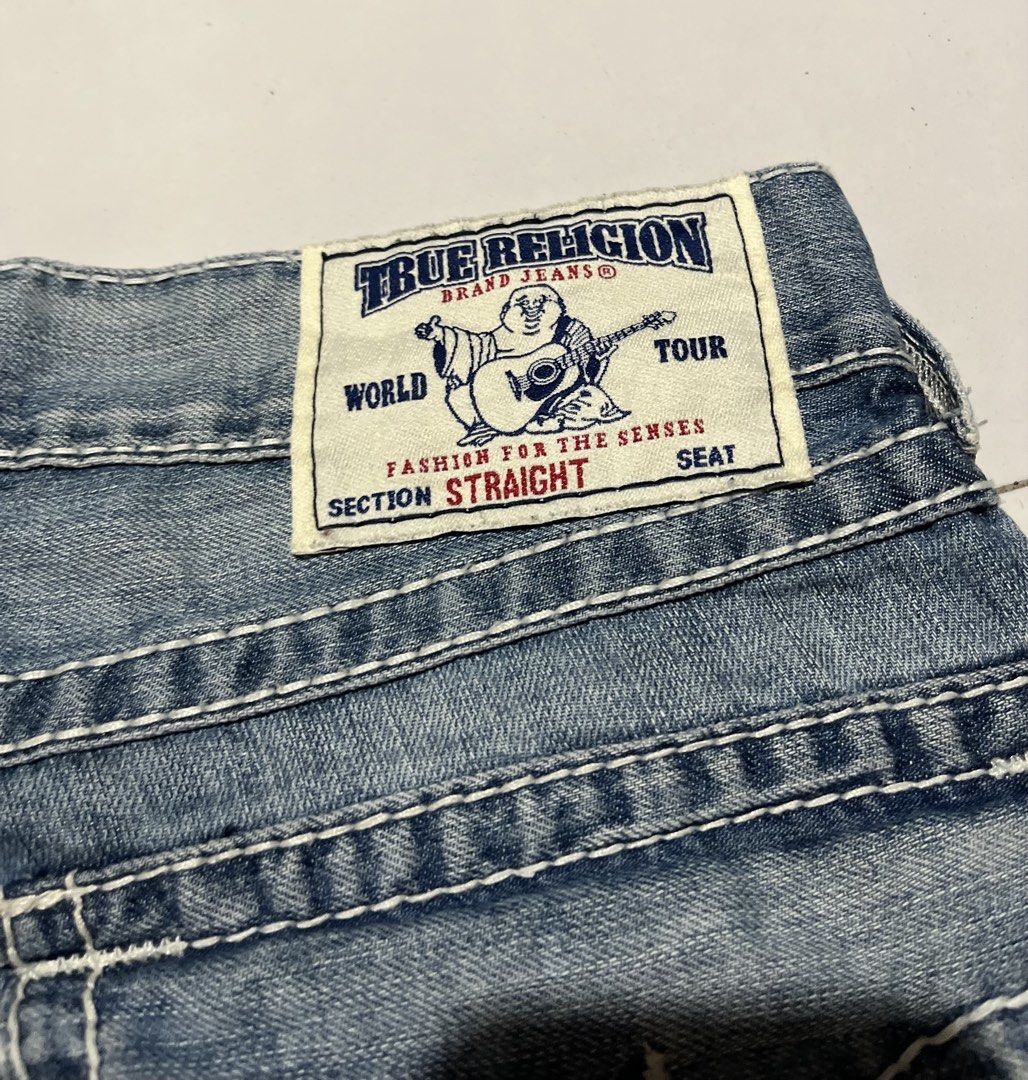 True Religion Jeans Distressed Blue Denim (Category: Jeans) located in Opol. Submitted by johnalbert.thrift (Listing ID 1452608752, Image 3). Description: - Classic blue denim jeans - Stylish distressed details - Clean white contrast stitching - Comfortable straight leg fit - Ideal for everyday casual wear -size 31 on tag -33x43.