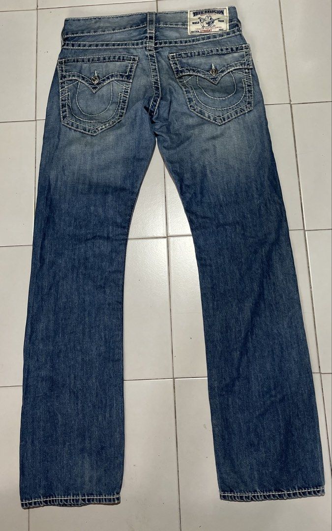 True Religion Jeans Distressed Blue Denim (Category: Jeans) located in Opol. Submitted by johnalbert.thrift (Listing ID 1452608752, Image 2). Description: - Classic blue denim jeans - Stylish distressed details - Clean white contrast stitching - Comfortable straight leg fit - Ideal for everyday casual wear -size 31 on tag -33x43.