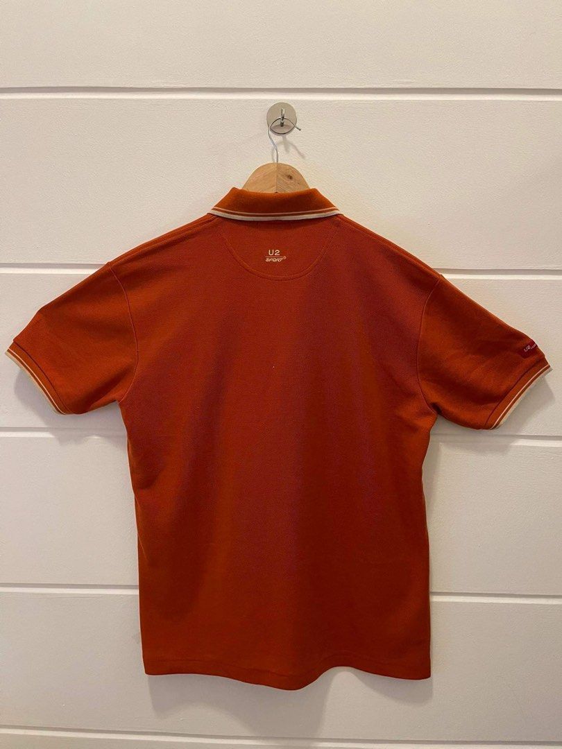 U2 Men's Orange Polo Shirt (Category: Tshirts & Polo Shirts ) located in Makati City. Submitted by dripfitsmanila (Listing ID 1452521827, Image 3). Description: - Orange U2 polo shirt - Short sleeves with striped trim on collar and cuffs - Small U2 logo embroidered on the chest - Button-up neckline - Ideal for casual outings and everyday wear.