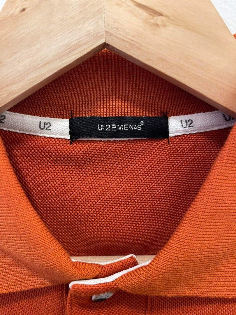 U2 Men's Orange Polo Shirt (Category: Tshirts & Polo Shirts ) located in Makati City. Submitted by dripfitsmanila (Listing ID 1452521827, Image 2). Description: - Orange U2 polo shirt - Short sleeves with striped trim on collar and cuffs - Small U2 logo embroidered on the chest - Button-up neckline - Ideal for casual outings and everyday wear.