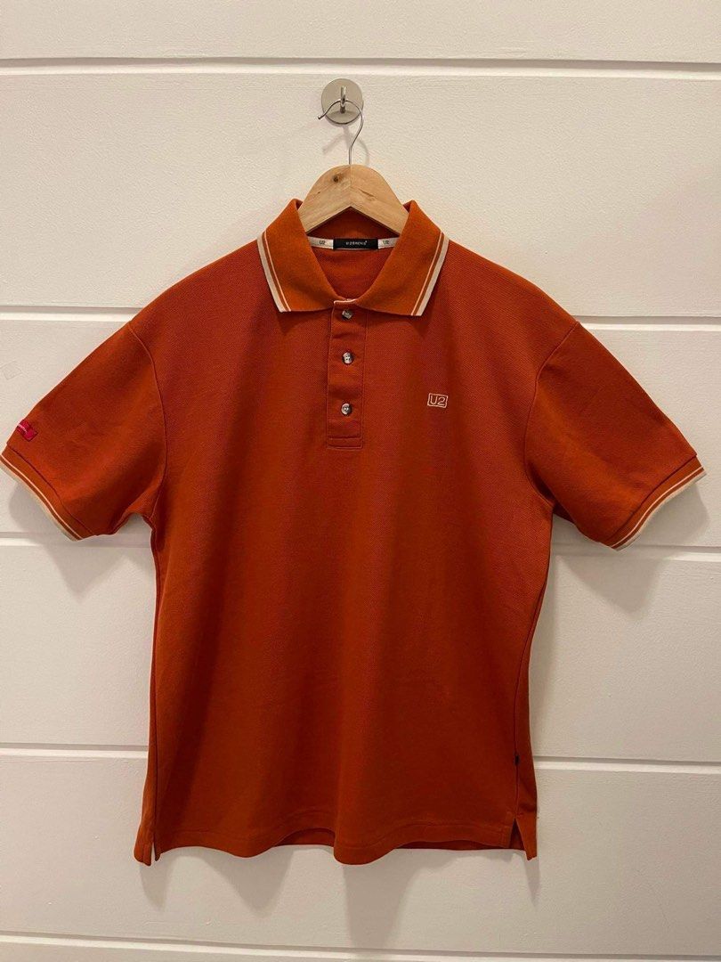 U2 Men's Orange Polo Shirt (Category: Tshirts & Polo Shirts ) located in Makati City. Submitted by dripfitsmanila (Listing ID 1452521827, Image 1). Description: - Orange U2 polo shirt - Short sleeves with striped trim on collar and cuffs - Small U2 logo embroidered on the chest - Button-up neckline - Ideal for casual outings and everyday wear.