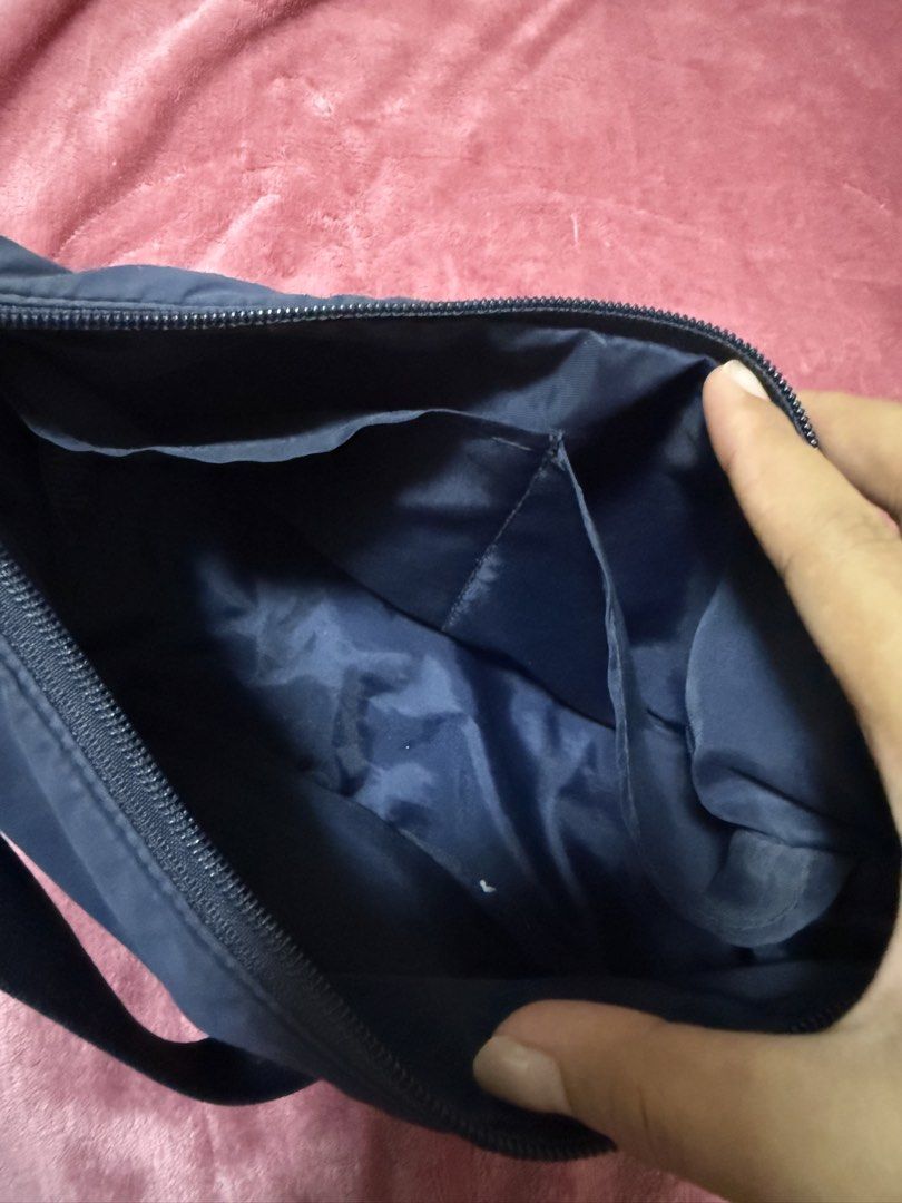 UNIQLO DARK BLUE ROUND MINI SHOULDER BAG (Category: Shoulder Bags) located in Quezon City. Submitted by frannecess (Listing ID 1452681395, Image 3). Description: 🌸FOR SALE🌸 UNIQLO DARK BLUE ROUND MINI SHOULDER BAG Rarely used RFS: too many bags need to dispose Slightly nego for sure buyer Loc: Pasong Tamo, Quezon City.