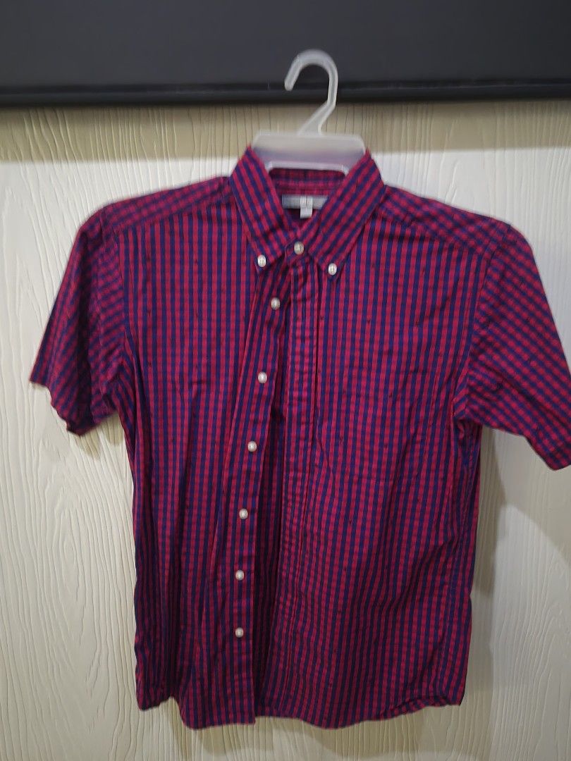 Uniqlo Red Blue Gingham Star Button Down Shirt Size S (Category: Tshirts & Polo Shirts ) located in Angeles City. Submitted by marvinjbm110069 (Listing ID 1452654814, Image 1). Description: - Uniqlo Shirt - Red and blue gingham pattern with small black stars - Button-down style with collar - Size: S - Perfect for casual wear.
