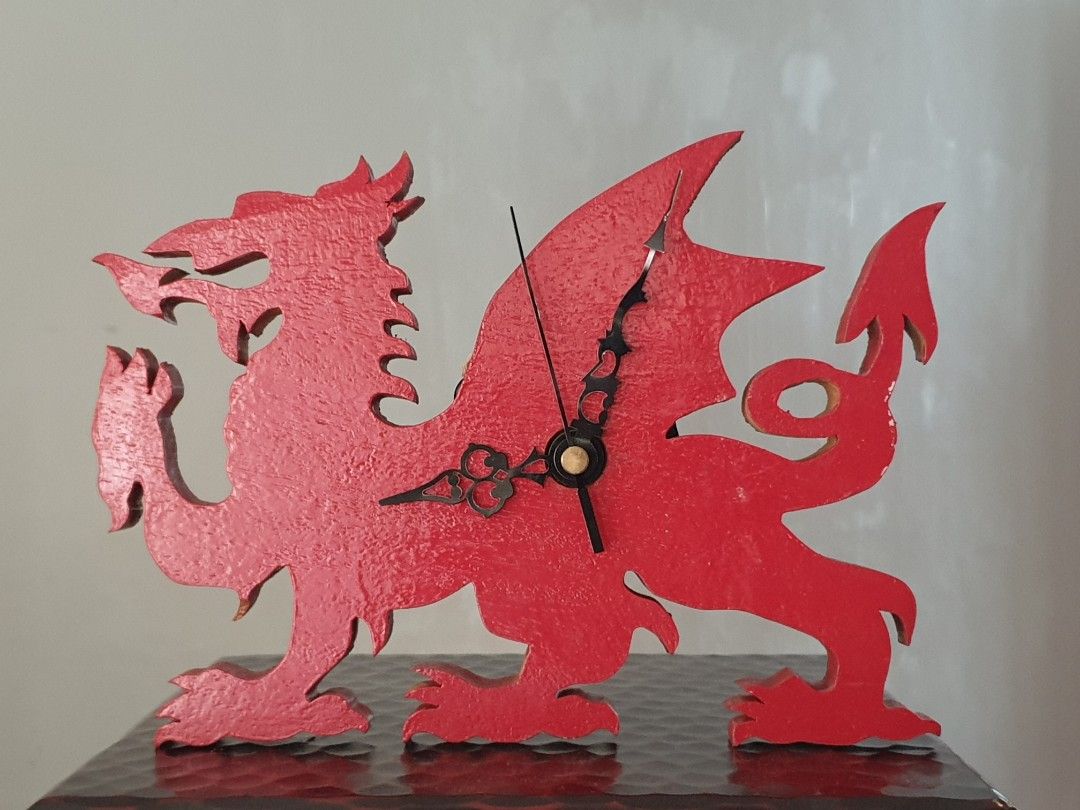 Unique Welsh Dragon Clock Wooden Wall Hang (Category: Wall Decor) located in Las Pinas. Submitted by oldsthetics (Listing ID 1452628564, Image 2). Description: Unique Welsh Dragon Clock Wooden Wall Hang Great accent and mancave piece See photo for size This is a used item Working condition Preloved and not new May have imperfections Typical of age and usage bearable chip (see photo) Open type - hands are exposed causing some to bend Overall: work