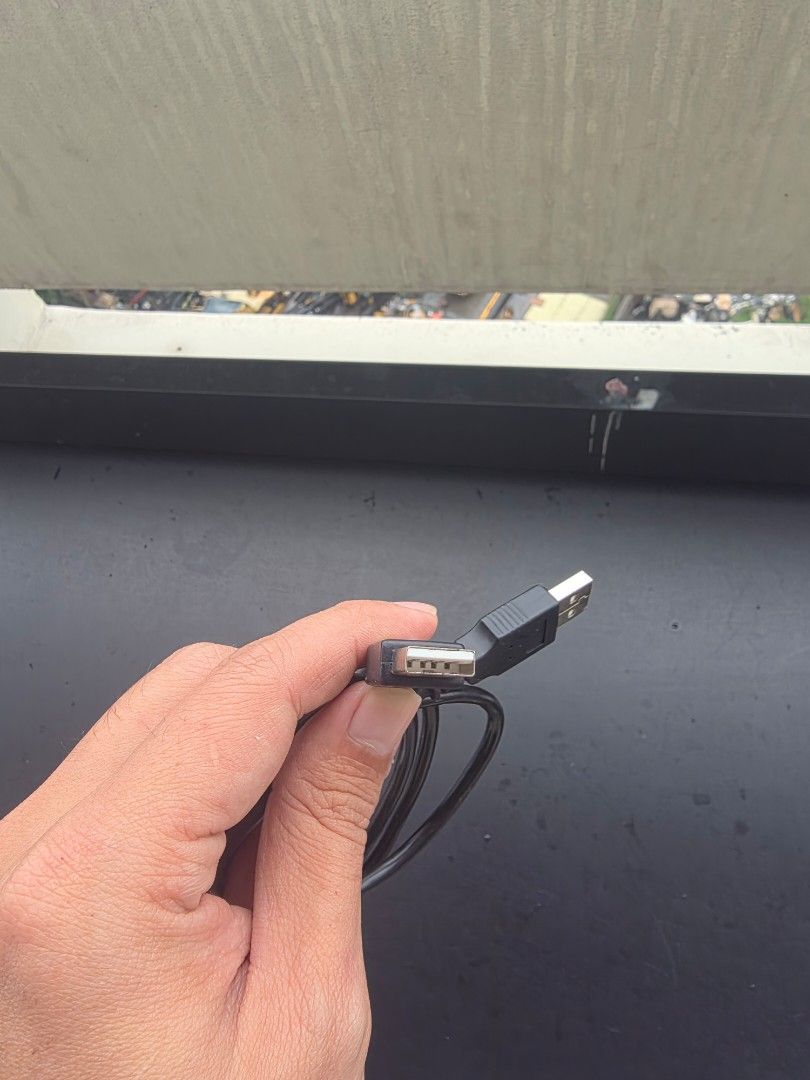 USB A to USB A Cable (Category: Chargers & Cables) located in Manila. Submitted by sound.solution (Listing ID 1452655545, Image 2). Description: - Standard USB A to USB A cable male to male - Black wire, approximately 3 feet long - Ideal for printers and external hard drives - Tested and confirmed working, no issues.