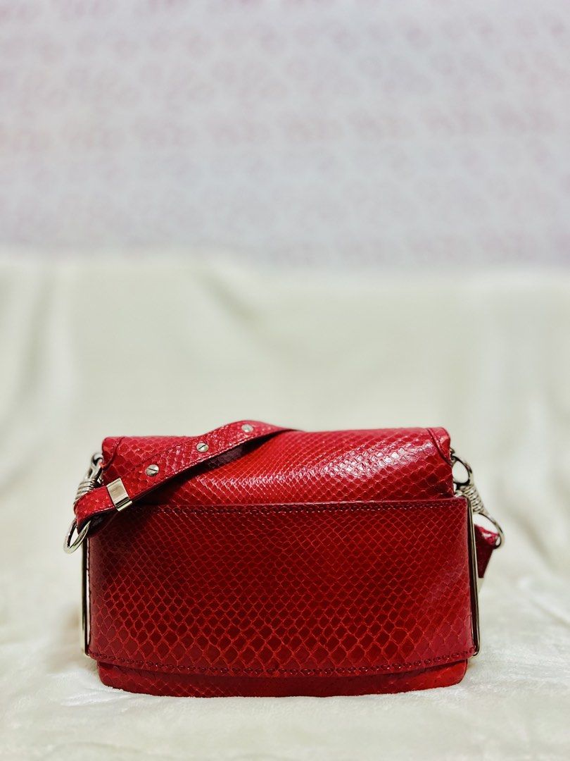 Versace Red Python and Suede Flap Shoulder Bag (Category: Luxury Bags & Wallets) located in Santa Rosa. Submitted by yourgirl0816 (Listing ID 1452599777, Image 2). Description: Gender: Woman Includes: Original Dustbag, Info Booklet Length: 25 cm Width: 3 cm Height: 17 cm Handle Drop: 24 cm Hardware: Silver Tone Exterior Material: Python and Suede Interior Material: Suede and Fabric Origin: Italy.