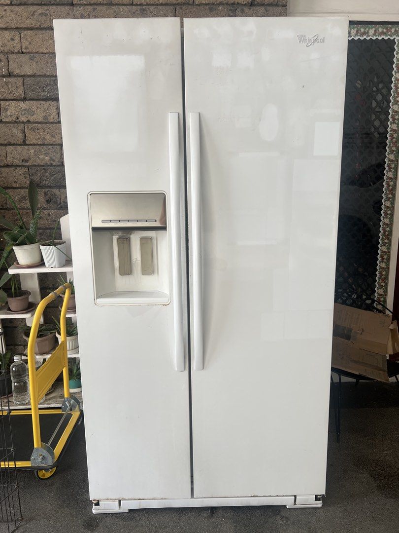 Whirlpool Side-by-Side Refrigerator with Water Dispenser (Category: Refrigerators and Freezers) located in Quezon City. Submitted by eisleya (Listing ID 1452661004, Image 1). Description: - White Whirlpool side-by-side refrigerator - Convenient water dispenser on the left door but need repair - All interior shelves and drawers are intact. No broken part. - Ample storage space inside - In working condition, but sometimes the refrigerator side gets