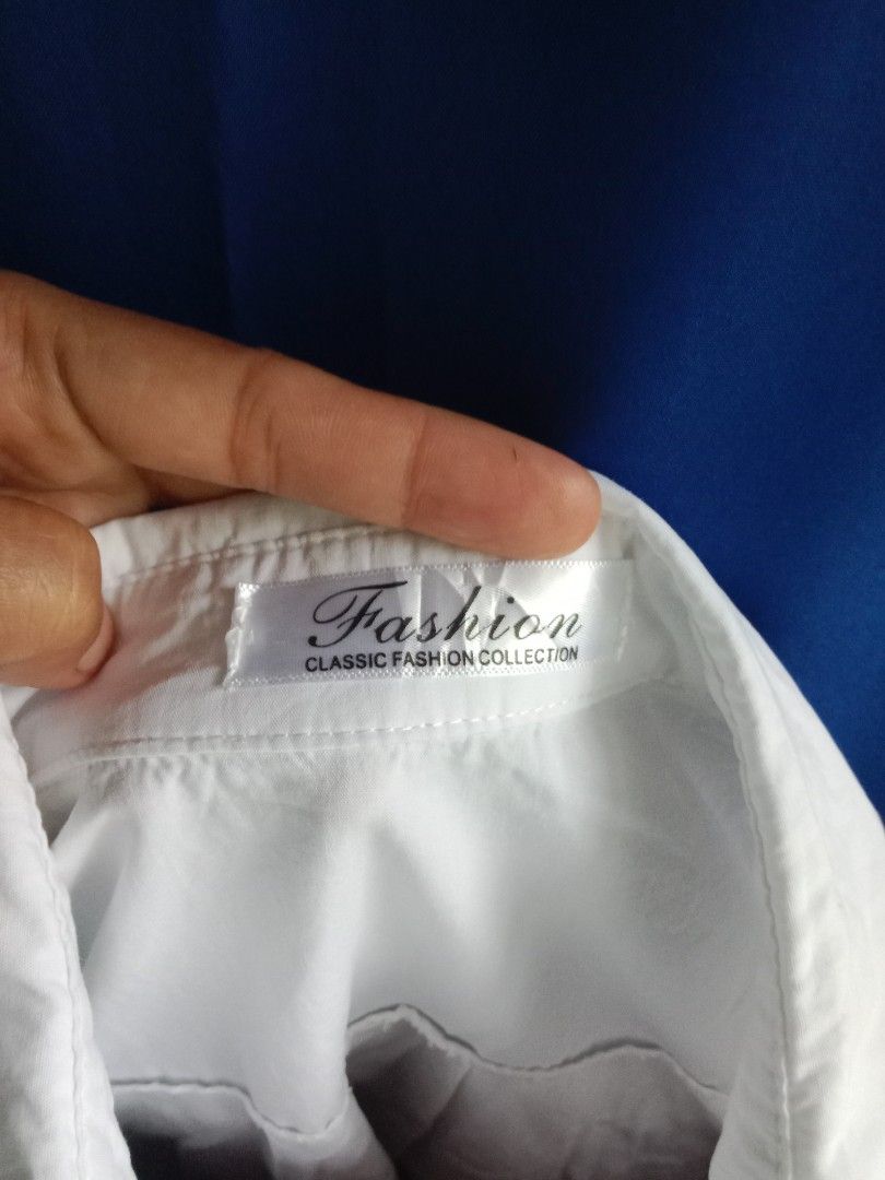 white cotton longsleeve button down shirt (Category: Shirts) located in Bontoc. Submitted by irene_banganan (Listing ID 1452512633, Image 3). Description: white cotton longsleeve button down shirt fits small to medium makapal, no stretch, nice quality has tiny sewn hole, not so obvious when worn still in excellent condition.