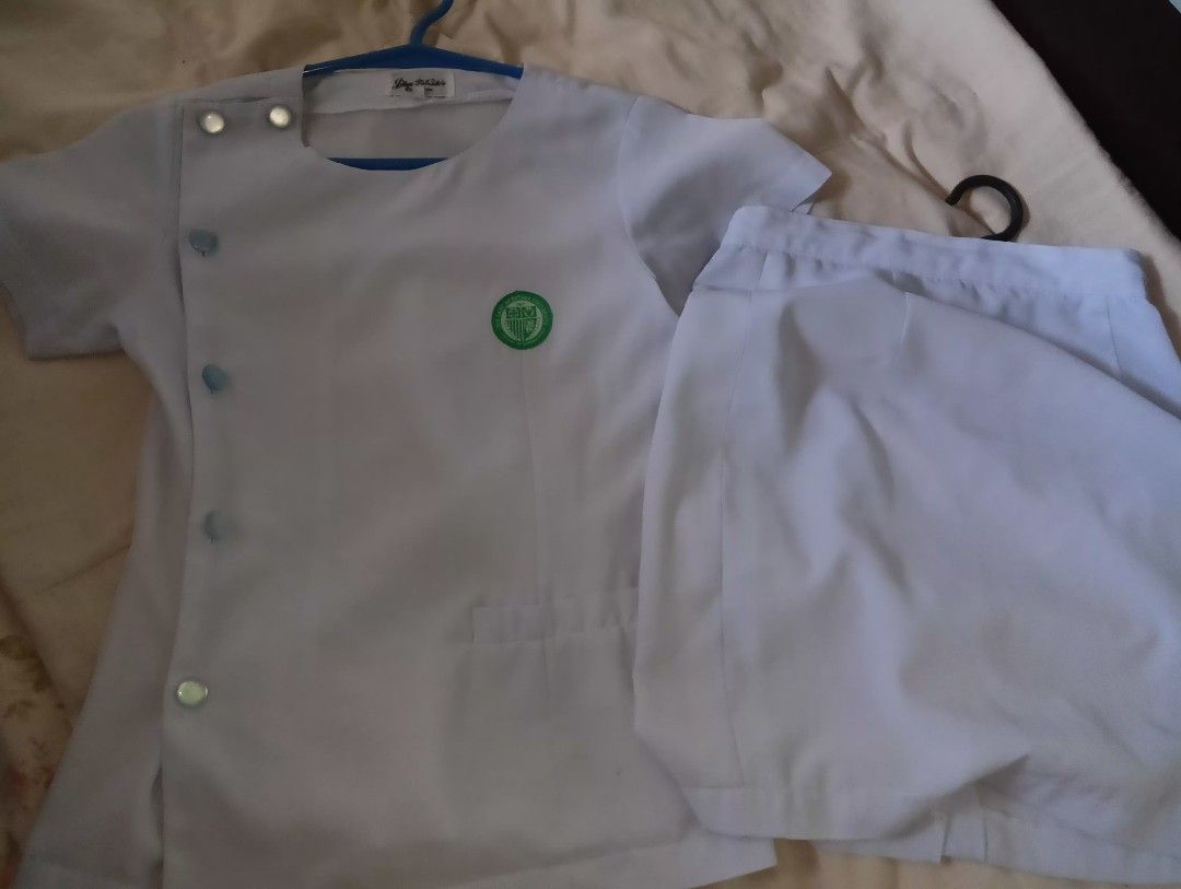 White Nurse/Medical Student Uniform Set (Category: Sets or Coordinates) located in Muntinlupa City. Submitted by cjcalcifier (Listing ID 1452510051, Image 1). Description: - White uniform set suitable for OLFU 1st-2nd year uniform Medtech - Top features convenient snap button closure. - Pants have a secure zipper and button closure. - Embellished with a green emblem on the chest. - Estimated size: Small to Medium. - Perfect for clinical duties an