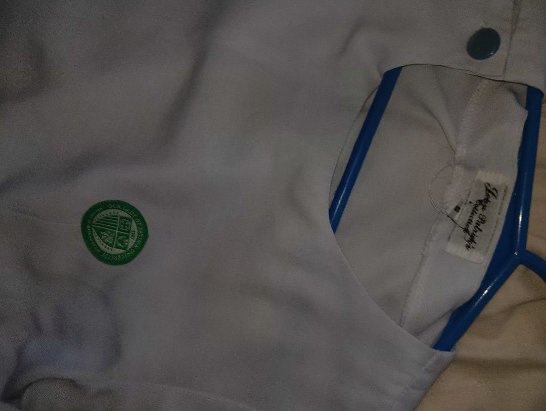 White Nurse/Medical Student Uniform Set (Category: Sets or Coordinates) located in Muntinlupa City. Submitted by cjcalcifier (Listing ID 1452510051, Image 2). Description: - White uniform set suitable for OLFU 1st-2nd year uniform Medtech - Top features convenient snap button closure. - Pants have a secure zipper and button closure. - Embellished with a green emblem on the chest. - Estimated size: Small to Medium. - Perfect for clinical duties an