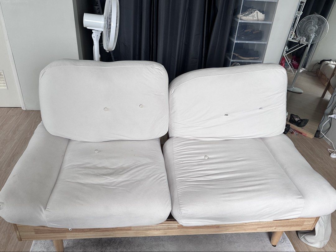 Wooden Frame Sofa Bed with White Cushions (Category: Sofas) located in Quezon City. Submitted by angelnzd (Listing ID 1452529846, Image 3). Description: NEGOTIABLE SOFA COVER WASHABLE Can also buy whole set of new ones since its removable naman Wooden frame very sturdy no issues - Convertible sofa bed with a sturdy solid wood frame. - Features removable white cushions for easy cleaning. - Versatile design: use as a comfortable sofa or a convenien