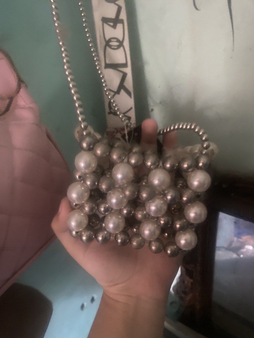 Woven Mini Pearl and Silver Bead Micro Bag (Category: Purses & Pouches) located in Cebu City. Submitted by declutters_01 (Listing ID 1452600428, Image 2). Description: 📌Stella Accessories Woven Mini Pearl and Silver bead Micro Bag 🏷️ ₱250 (Orig Price: ₱410) - Brand new, Never Used - Elegant Pearl Micro hand bag - Size of my palm - Crossbody beaded chain - Authentic PAYO (Pay As You Order) only! 📦Delivery only! [via jnt] 📍Cebu City 🧾 Mode of 