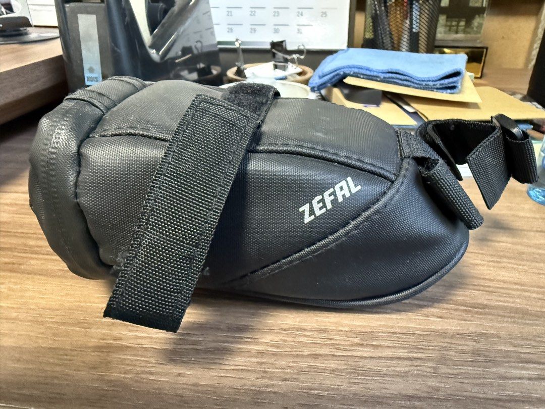 ZEFAL Bicycle Saddle Bag (Category: Bicycles) located in Quezon City. Submitted by ivd01 (Listing ID 1452695140, Image 3). Description: ZEFAL saddle bag - Color: Black - Condition: 10/10 - Size: Small - Attaches securely under your bike seat - Compact size for carrying essentials - Made from durable material - Perfect for quick repairs while cycling - Easy to strap on and remove.