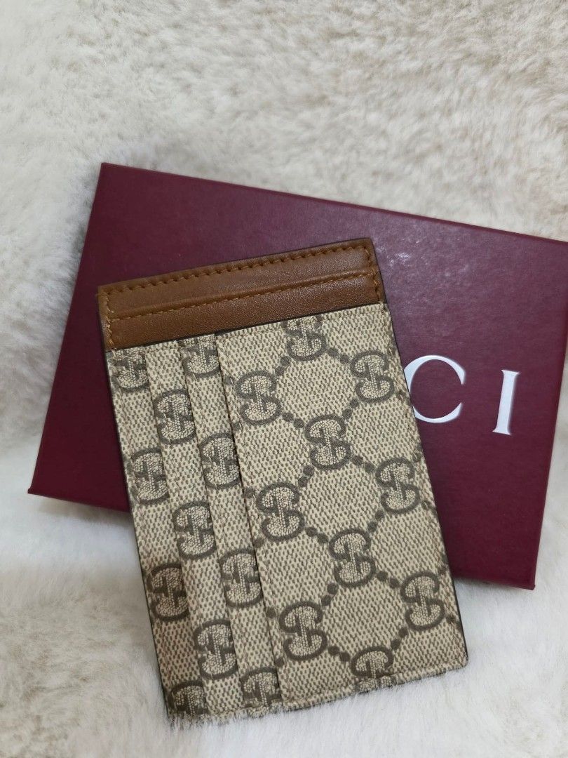 100% Authentic Gucci Card Case (Category: Luxury Bags & Wallets) located in Quezon City. Submitted by barbosac (Listing ID 1447304673, Image 1). Description: Güççi Card Case Inclusions: box and dustbag Can fit up to 15 cards 10,500php free air cargo Loc: Bulacan lalamove or LBC.
