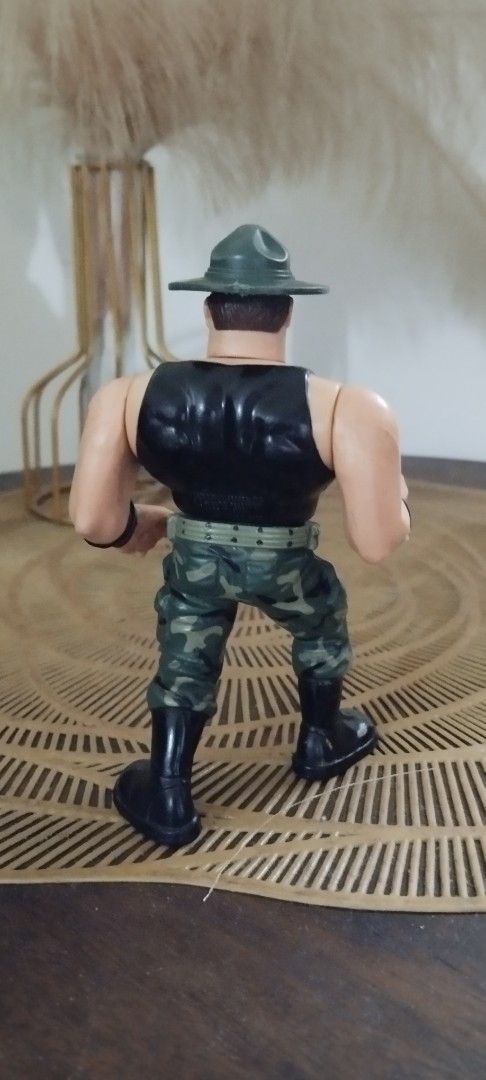 1991 Hasbro WWF Sgt. Slaughter (Category: Action & Battle Toys) located in Manila. Submitted by ventajetoyz625 (Listing ID 1447330152, Image 3). Description: - Vintage action figure - "Gimmick" working - With minimal chipped paint - Ideal for toy enthusiasts - What you see is what you get or display.